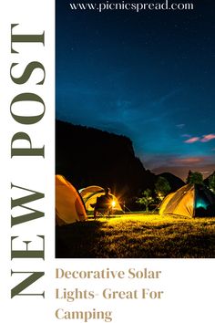 an advertisement for a camping site with tents in the grass and lights shining on them