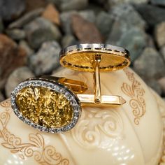 These fine 18K yellow gold cufflinks are topped with 20K yellow gold nugget that are each bordered with twenty-seven (27), bead set, round single cut diamonds. The cufflinks measure 23.1mm X 18.0mm. Gold Polished Finish Cufflinks For Gift, Luxury 22k Gold Jewelry Stamped 14k, Gold Earrings With Single Cut Diamonds For Formal Occasions, Formal 22k Yellow Gold Jewelry, Luxury 22k Gold Earrings For Formal Occasions, Anniversary Engraved Yellow Gold Cufflinks, Diamond Polished Finish Cufflinks As Gift, Diamond Cufflinks With Polished Finish For Gift, Diamond Cufflinks With Polished Finish