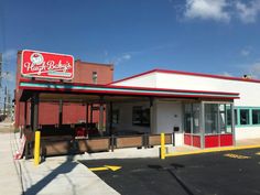 an empty parking lot in front of a restaurant