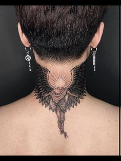 the back of a woman's neck with tattoos on it