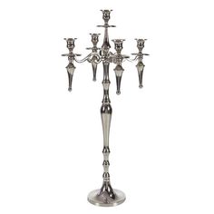 a silver candelabra with five candles on it's sides and four arms