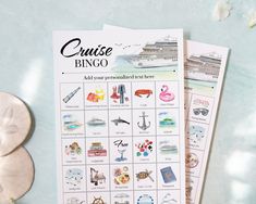 the cruise bingo game is next to some seashells