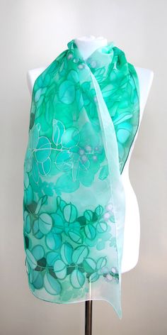 Jade silk scarf, hand paint with silk paint in green and turquoise shades on white. Size: 61 by 17 inches Silk: pure Habotai Light, semi transparent and a bit glossy This long, light scarf is ready to be shipped! It is hand painted with special silk paints that can be washed (for silk sake, please wash by hand! I am attaching an easy-to-follow instruction). The scarf won't fade! On this white and green silk wrap I have painted jade plant (you know it? Super popular indoor Crassula plant that bri Green Bohemian Silk Scarf As Gift, Green Bohemian Silk Scarf For Gift, Bohemian Green Silk Scarf As Gift, Green Silk Scarves For Summer, Artistic Hand Dyed Green Silk Scarf, Hand Painted Green Silk Scarf, Artistic Green Silk Scarf As A Gift, Artistic Hand Painted Green Silk Scarf, Handmade Green Bohemian Silk Scarf