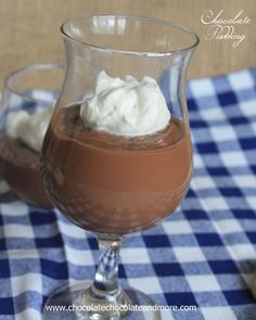 two glasses filled with chocolate pudding and whipped cream