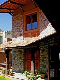 an outside view of a house with stone walls