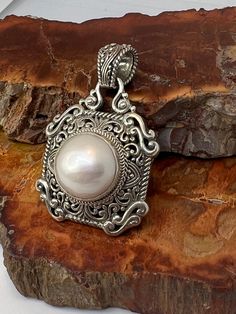 This is a beautiful Sarda Sterling and pearl  pendant  , size shown in pics. Definitely a statement piece , can fit on a large style chain Elegant Pearl Necklace With Large Pendant, Handmade Elegant Pearl Necklace With Round Pendant, Elegant Handmade Pearl Necklace With Round Pendant, Ornate White Pearl Pendant Jewelry, White Pearl Necklace With Large Pendant, Elegant Pearl Necklace With Large Pendant As Gift, Elegant White Necklace With Large Pendant, Elegant White Necklaces With Large Pendant, Pearl Pendant