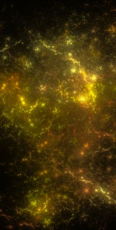 an image of some yellow and green lights in the night sky, taken from space