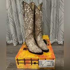 Preloved Corral G1128 Bone Lace Floral Embroidery Boots Tall Size 7. Preowned, But Still In Excellent Condition With Minimal Signs Of Use As Shown In Pics. Comes With Original Corral Boot Box. Very Rare And Retired Style! “The Corral Bone Tall Lace Embroidery Boots G1128 Are Complete Show Stoppers! We Absolutely Love The Distressed Bone Leather And The Gorgeous White Floral Embroidery That Covers The Boot Exterior. The Taller Boot Shaft Is So Stylish And The Stacked Heel Will Give You Extra Heig Fitted Snip Toe Wedding Boots, Fitted Cream Boots For Wedding, Embroidery Boots, White Floral Embroidery, Embroidery Wedding, Boots Tall, Wedding Boots, Corral Boots, Cowboy Boots Women