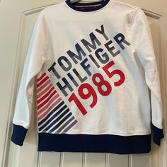 Boys Size 12/14 Sweatshirt White Winter T-shirt With Logo Print, Tommy Hilfiger Sporty Logo Print Tops, Casual Tommy Hilfiger Logo Print Sweatshirt, Sporty Tommy Hilfiger Sweatshirt With Logo Print, Tommy Hilfiger Logo Print Sweatshirt For Fall, Casual Tommy Hilfiger Sweatshirt With Logo, Tommy Hilfiger Letter Print Sweatshirt For Winter, Tommy Hilfiger Casual Logo Print Sweatshirt, Tommy Hilfiger Sporty Sweatshirt With Logo Print