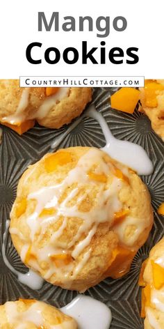 mango cookies with icing and oranges on top