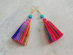 "These are a hand-crafted pair of earrings that have been made from colored cotton yarn and round turquoise beads. They will be a perfect gift for the bohemian style lovers or for yourself to enjoy! Length 3.2\" About Shipping: **Free Worldwide Shipping on Orders Over $35** Delivery time for regular airmail is 14-20 days. Please track your order below: https://www.dhl.com/global-en/home/tracking.html Or USPS.com (for US address) We recommend DHL Express shipping upgrade and your order will arriv The Bohemian, Boho Stil, Turquoise Beads, Tassel Earrings, Cotton Yarn, Tassel Necklace, Multi Colored, Bohemian Style, Jewelry Earrings Dangle