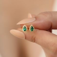 Discover timeless elegance with our handcrafted 14K solid gold earrings, featuring genuine diamonds and vibrant emerald gemstones, the birthstone for May. These luxurious drop stud earrings are meticulously designed to offer both style and sophistication. Each piece is carefully created with the highest quality materials, ensuring that you receive a product not only beautiful but also durable. Dimensions for these exquisite earrings are thoughtfully chosen to enhance aesthetic appeal while provi Green Gemstone Diamond Earrings For Gift, Green Gemstone Diamond Earrings As Gift, Pear-shaped Earrings For Anniversary With May Birthstone, Gift Green Diamond Earrings, Pear-shaped May Birthstone Earrings For Anniversary, Anniversary Pear-shaped May Birthstone Earrings, Diamond Earrings For May Birthstone Gift, Gold Diamond Earrings For May Birthstone, Anniversary Gold Diamond Earrings With Emerald