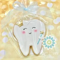 a decorated cookie in the shape of a tooth