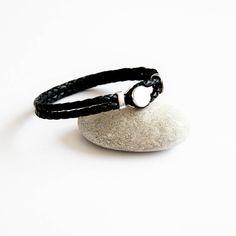 Leather and Sterling Silver Bracelet Everyday Silver Leather Bracelet With Black Band, Modern Sterling Silver Leather Bracelet For Everyday, Modern Silver Leather Bracelet As Gift, Modern Silver Leather Bracelet Gift, Modern Sterling Silver Braided Bracelet Gift, Modern Black Leather Bracelet With Sterling Silver, Modern Black Leather Bracelet For Gift, Modern Silver Braided Bracelets With Leather Strap, Modern Black Leather Bracelet