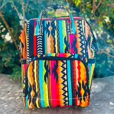 The Aztec Warrior Diaper Bag is very roomy and bright and beautiful. This bag has multiple zipper pockets and cubbies to put necessities. 13" L X 8" W Multicolor Bags With Zipper Closure For Trip, Multicolor Laptop Bag For Trips, Multicolor Satchel Backpack With Zipper, Multicolor Satchel Backpack With Zipper Closure, Multicolor Rectangular Backpack For Everyday Use, Rectangular Multicolor Backpack For Everyday Use, Multicolor Rectangular Backpack With Zipper Pocket, Multicolor Rectangular Outdoor Travel Bag, Multicolor Bags With Zipper Pocket For Trips