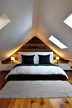 an attic bedroom with slanted ceilings and white bedding, along with two lamps on either side of the bed