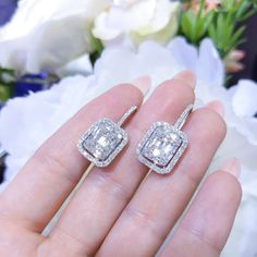 Very high quality round and baguette diamonds in a prong set cluster, surrounded by a diamond halo. All jewelry sales come with an appraisal including replacement value. Carat Range 2.0-2.5 Clarity VS2-SI1 Color F-G Cut Bagutte, Round GemStone Diamond - April Material 14k White Gold Shop Prong, Diamond, Fashion, Dangle Diamond Emerald-cut Halo Earrings, Luxury Diamond Earrings With Baguette Cut Halo Design, Gia Certified Baguette Cut Diamond Earrings, Dazzling Baguette Cut Diamond Earrings, Emerald Cut Diamond Earrings With Halo Design, Emerald Cut Halo Diamond Earrings, Dazzling Baguette Cut Diamond Earrings For Anniversary, Diamond White Baguette Cut Halo Earrings, Diamond White Baguette Cut Earrings With Halo Design