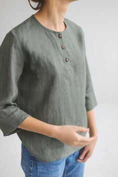 100% organic linen shirt with buttons in the top is perfect for summer. This model has loose design, wide 3/4 sleeves that can be rolled up. This plus size linen top will make your life much more simple, just put it on with any bottoms and classy&casual look is guaranteed! Wear it for everyday, for work, for trips and holidays. Organic linen fabric will make sure your skin breathes and ensure air circulation. You can choose your favorite color from 25 possible variations in the drop down men Linen Tops With 3/4 Sleeves And Buttons, Plus Size Linen, Shirt With Buttons, Linen Tops, Summer Linen, Oversized Blouse, Classy Casual, Air Circulation, Organic Linens