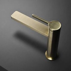 a metal handle on a black surface