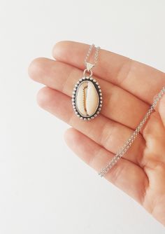 "A Sterling silver Cowrie Pendant - The prefect necklace for your bohemian looks ! *It has been made from scratch by me using sterling silver sheet and wire. *Finished with a black patina and brought to a shine. * 18\" Long -Hanging from a sterling silver chain . *You can find the matching ring here: https://www.etsy.com/listing/676737408/sterling-silver-cowrie-shell-ring-sea?ref=shop_home_active_2&frs=1 *This necklace is made to order.Please up to 1 week to have it ready for you.It will com Boho Looks, Cowrie Shell Necklace, Shell Ring, Matching Ring, Bohemian Beach, Rose Quartz Ring, Boho Pendant, Bohemian Rings, Summer Necklace