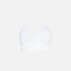 White linen bralette topElastic backRegular fitCoordinating itemComposition: 100% linen Chic Triangle Crop Top With Built-in Bra, Chic Spring Tank Top With Removable Bra Pads, Chic Linen Crop Top, Chic V-neck Crop Top, Chic V-neck Bra-friendly Crop Top, Summer Camisole With Removable Bra Pads, Elegant Cropped Crop Top For Beach, Elegant Crop Top For Beach, Chic Fitted Linen Tank Top