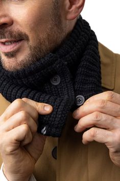 a man wearing a black knitted scarf