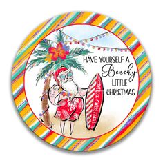 a round christmas ornament with an image of a woman holding a surfboard