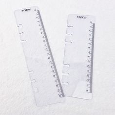 two clear rulers with the words today and today written on them are laying next to each other