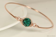 Rose Gold Emerald Swarovski Crystal Bracelet Handmade by Jessica Luu Jewelry ~ Faceted ~ Versatile ~ Elegant ~ With every wave of your hand, there will be a sparkle of emerald green at your wrist as this bangle moves around. Emerald is the birthstone for May making this a thoughtful birthday gift for someone special. MATCHING ITEMS https://www.etsy.com/shop/JessicaLuuJewelry?search_query=emerald MATERIALS: ~ 10mm emerald Swarovski crystal ~ 14K gold filled wire HOW IT'S MADE: A large Swarovski c Emerald Crystal, Swarovski Crystal Bracelet, Large Crystal, May Birthstone, Rose Gold Bracelet, Slide On, Large Crystals, Faceted Crystal, Bracelet Handmade