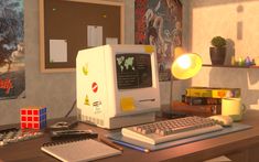 a computer sitting on top of a wooden desk