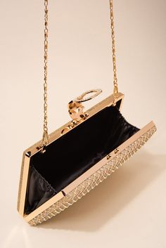 Description Where luxury meets affordability, make a sophisticated, yet notable impression on anyone who sees you with our rhinestone-embellished evening bag! They are perfect for both formal and casual events, parties, gatherings, ceremonies, celebrations, and more! Size Length: 7.5 in (19.05 cm) Width: 5 in (12.7 cm) Depth: 1.25 in (3.18 cm) Strap: 45 in (114.3 cm) Quality This evening bag is secured with a metal alloy latch and paved with rhinestones. There are also rhinestones embellished in Pearl Shop, Holiday Essentials, Pearl Set, Gold Rhinestone, Halloween Birthday, Polka Dot Pattern, Pearl Ring, Black Rose, Fascinator