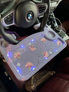 the interior of a car with various items on it