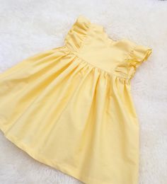 "The listing is for one dress. These dresses has an average fit around the bust, measure your child around the bust and add 1-2\" for ease and choose the size closest. Size Chest Length 0-3m 17.5\" 13\" 3-6m 18.5\" 14\" 6-12m 19.5\" 16\" 12-18m 20.5\" 17.5\" 18-24m 21\" 19\" 2t 21.5\" 20\" 3t 22.5\" 21\" 4t 23.5\" 22\" 5y 24.1/4\" 23\" 6y 25.1/4\" 24\" 7y 26.5\" 25\" 8y 27 3/4\" 27 DETAILS: --------------- Please Note: There are no refunds, exchanges or returns. All sales are final. Please note: Yellow Easter Dress, Toddler Thanksgiving Outfit, Easter Toddler, Thanksgiving Toddler, Toddler Birthday Dress, Girls White Dress, Toddler Easter, Toddler Birthday, Coming Home Outfit