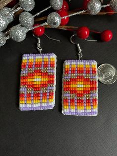 "Native America Indian Jewelry. This is a stunning pair of hand beaded Navajo earrings. These are made by a family of talented Navajo women. These are tiny seed beads in a traditional Navajo rug design using lavender, gold, red, orange, yellow & white colored beads. They're in excellent new condition measuring 2 3/4\"L x 1\"W. A perfect addition to any jewelry box & perfect gift for Valentine's Day Please view all pics carefully . Welcome!" Southwestern Style Large Beads Earrings For Gift, Traditional Hand-strung Earrings For Gifts, Traditional Rectangular Jewelry With Colorful Beads, Traditional Handwoven Rectangular Jewelry, Traditional Handwoven Jewelry, Traditional Beaded Hoop Earrings, Handmade Southwestern Rectangular Jewelry, Bohemian Rectangular Beaded Earrings With Ear Wire, Bohemian Rectangular Earrings With Colorful Beads