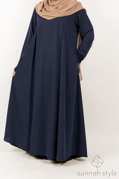 Our Belle Umbrella Abaya features an elegant classic cut combined with functional features. The abaya is designed with darts under the bust at the front and back which allow it to flow away from the body for an elegant and modest fit. It includes a 12" zipper at the neck as well as side pockets for keeping your keys, phone and other necessities close at hand. Abaya Black, Modest Fits, Abaya Designs, Black Sapphire, Nursing Friendly, Green Sapphire, Fabric Texture, Crepe Fabric, Sleeve Styles