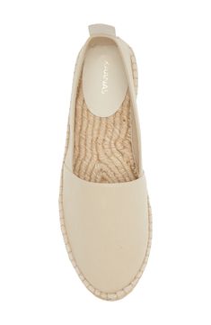 Earthy textures give a summery feel to this canvas flat that's set on a espadrille-inspired sole. Textile upper and lining/synthetic sole Imported Hispanic & Latinx Owned/Founded Natural Espadrilles With Textured Footbed For Vacation, Cream Slip-on Espadrilles With Woven Sole, Natural Fabric Espadrilles For Vacation, Natural Colored Espadrilles For Vacation, Beige Flat Espadrilles For Spring, Casual Linen Espadrilles With Round Toe, Vacation Beige Espadrilles With Woven Sole, Beige Closed Toe Espadrilles With Woven Sole, Beige Espadrilles With Woven Sole For Vacation