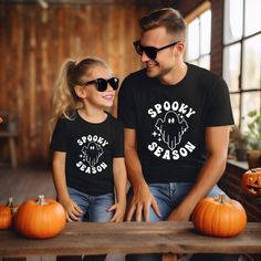 **Celebrate Halloween Together with Matching Family T-Shirts Make this Halloween unforgettable with our stylish matching family t-shirts, designed to add a spooky yet coordinated touch to your festivities. Perfect for family photos and trick-or-treating, these comfortable and durable t-shirts are a must-have for every member of your spooky squad. **Key Features - **Comfortable Fabric Soft cotton blend ensures all-day comfort. - **Spooky Designs Choose from a variety of Halloween-themed designs i Father Daughter Shirts, Matching Family T Shirts, Outfit Halloween, Halloween T Shirts, Daughters Shirt, Halloween Tshirt, Spooky Designs, Halloween Designs, Halloween Outfit