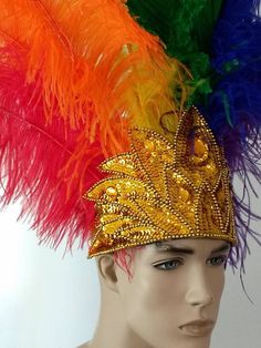 We make and ship our items really fast if you need it for a specific date please let us know. or call/text us at 954-3051817 to complete your order over the phoneRainbow Pride Prime Ostrich Wing Plumes Feather Carnival Headdress Showgirl  on a Custom Tiara/crownWe only use the best quality of ostrich wing feathers. Each feathers is approximately 20" tall.The crown is completely hand beaded in sequined and acrylic beads.Feathers are a natural product therefore a slight variation in texture, color Carnival Crown Headpiece For Mardi Gras, Carnival Round Crown Headpieces For Costume Party, Carnival Costume Party Headpiece With Round Crown, Round Crown Headpiece For Carnival Costume Party, Mardi Gras Carnival Crown Headpiece, Crown Headpiece For Mardi Gras Carnival, Feathered Costume Hats And Headpieces For Mardi Gras, Feathered Hats And Headpieces For Mardi Gras Costume Party, Carnival Costume Headpiece With Round Crown