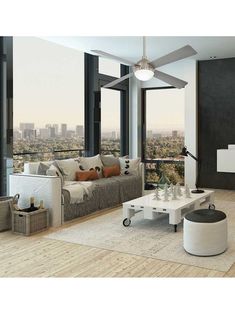 a living room filled with lots of furniture and large windows overlooking the cityscape