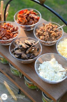 the food is prepared and ready to be eaten on the picnic table in the sun