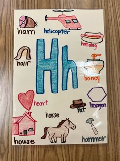 a drawing of the letter h with different types of animals and things to write in it