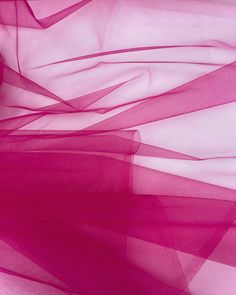 an abstract photo of pink sheer fabric