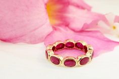 Eternity Ring with oval-shaped ruby bezel set horizontally.The 18K yellow gold is hand polished to get the smooth and refined look. The band is approximately 5 mm wide.Metal: 18K Yellow GoldGemstones: RubyTotal weight: 4.65 caratsThis ring cannot be resized.Available in 5-8 US ring size in full, and half sizes. If you need a smaller or larger size, please contact us.___________________________________________ALTERATIONS & CUSTOMOur jewelry is made to order and may be customized upon request (ie, Stackable Oval Ruby Ring In Fine Jewelry, Oval Stackable Ruby Ring In Yellow Gold, Fine Jewelry Stackable Oval Ruby Ring, Classic Oval Stackable Ruby Ring, Classic Oval Ruby Ring Stackable, Oval Ruby Ring Stackable For Formal Occasions, Oval Stackable Ruby Ring For Anniversary, Oval Ruby Stackable Ring For Anniversary, Anniversary Oval Ruby Stackable Ring