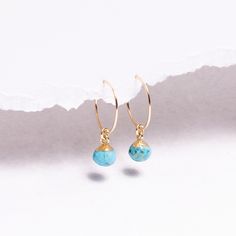 Turquoise Earrings - 14k Gold Filled Small and Dainty hoops - Boho, Minimalist style gifts for her - Bridesmaids gift ideas Gemstones: 9x6mm approximately Bezel: Vermeil Gold (14k Gold over Sterling Silver) Ear Wires: 14K Gold Filled Wire: 21 gauge / 0.70mm thick Wire Diameter: 15mm Gemstone: Genuine Turquoise Note that due to the handmade nature of these genuine stones, measurements are approximately and might vary slightly for each stone. Made in the USA. Jewelry Care: To extend the life of yo Turquoise Dangle Hoop Earrings For Gift, Turquoise 14k Gold Filled Earrings For Gift, Turquoise 14k Gold Filled Earrings As Gift, Gift Turquoise 14k Gold Filled Earrings, Elegant Turquoise Hypoallergenic Hoop Earrings, Turquoise Hypoallergenic Hoop Earrings As Gift, Turquoise Hypoallergenic Hoop Earrings For Gift, Minimalist Turquoise Hoop Earrings For Gifts, Minimalist Gemstone Hoop Earrings For Gift