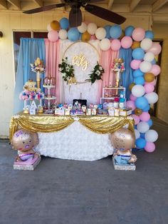 a frozen princess themed birthday party with balloons and dessert table set up for the event