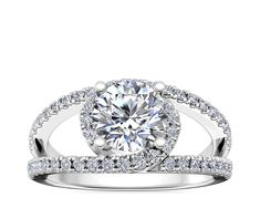 a white gold engagement ring with diamonds on it