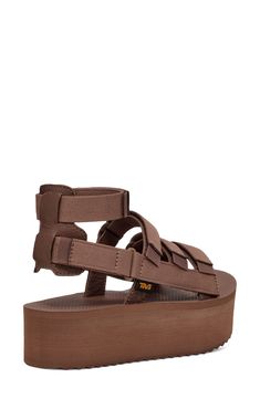 This sporty gladiator sandal revamp is boosted by a chunky platform sole, hook-and-loop closures and a removable ankle strap for added versatility. 1 3/4" platform Textile and leather upper and lining/rubber sole Imported Brown Synthetic Sport Sandals With Buckle Closure, Brown Synthetic Sport Sandals With Buckle, Casual Brown Sandals With Chunky Platform, Casual Brown Chunky Platform Sandals, Adjustable Ankle Strap Brown Sport Sandals, Adjustable Platform Sport Sandals With Ankle Strap, Adjustable Ankle Strap Platform Sport Sandals, Chunky Platform, Fabric Gift Bags