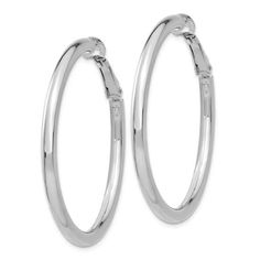 Rhodium over 14k white gold polished round hoop earrings. Measure approximately 1 5/8"L x 1/8"W and have omega clip back closure. Classic Round Hypoallergenic Clip-on Earrings, Classic Metal Hoop Earrings For Anniversary, Classic White Gold Clip-on Earrings With Polished Finish, Formal Metal Hoop Earrings With Shiny Finish, Modern Nickel-free Hoop Earrings For Formal Occasions, Modern Nickel-free Hoop Earrings For Formal Events, Modern Clip-on Hoop Earrings For Formal Occasions, Modern Clip-on Hoop Earrings For Formal Events, White Gold Metal Clip-on Jewelry