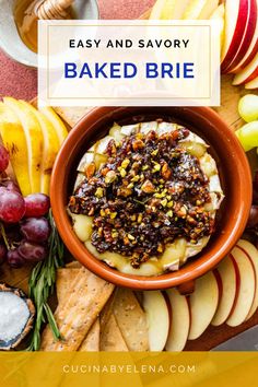 a bowl full of baked brie surrounded by fruit and crackers with the words easy and savory baked brie