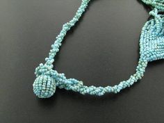 "22\" Double Twisting Turquoise Seed Beads Strand Layered Necklace This beautiful layered necklace is handbeaded. Each of the 16 layers are made of 2 twisting strands of seed beads. If you like opulent necklaces, this piece is for perfect for you. Bead Color: Turquoise Bead Type: Glass seed beads Necklace Length: 22\" (shortest strand) Necklace Weight: ~4.5oz Strand Count: 32" Adjustable Multi-strand Turquoise Beaded Necklace, Hand-strung Multi-strand Turquoise Necklace Gift, Handmade Multi-strand Turquoise Beaded Necklaces, Handmade Multi-strand Turquoise Beads, Turquoise Multi-strand Beads For Jewelry Making, Handmade Turquoise Multi-strand Beads, Turquoise Multi-strand Necklace For Jewelry Making, Turquoise Multi-strand Beaded Necklaces As Gift, Turquoise Multi-strand Beaded Necklace As Gift